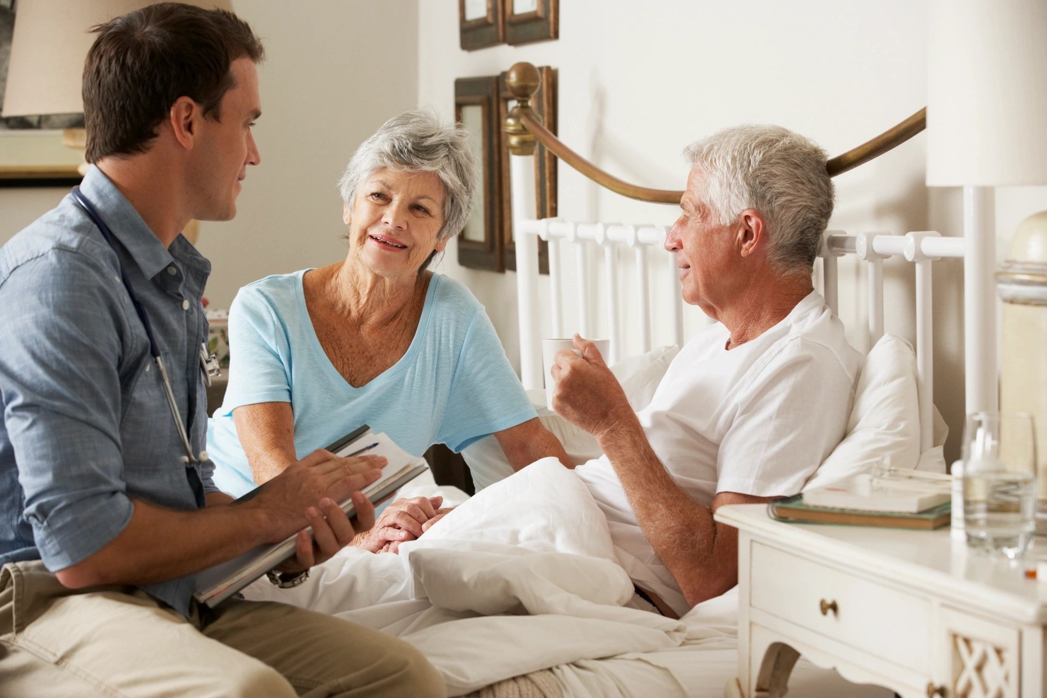 Caregiver supporting a patient with physical disability