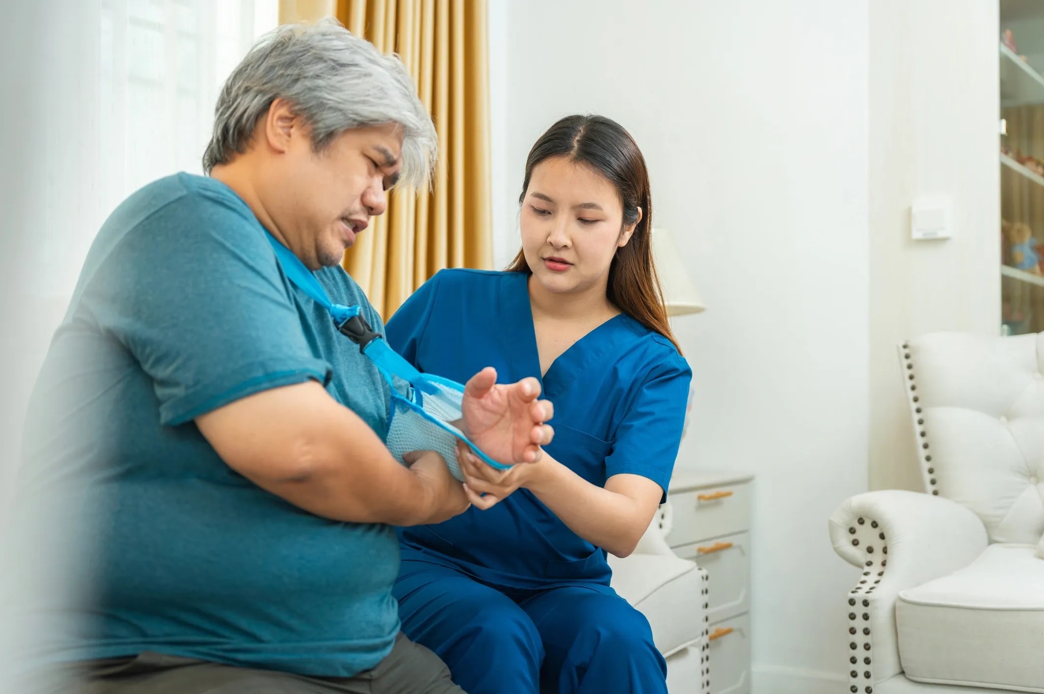 Caregiver providing post-surgical recovery assistance at home